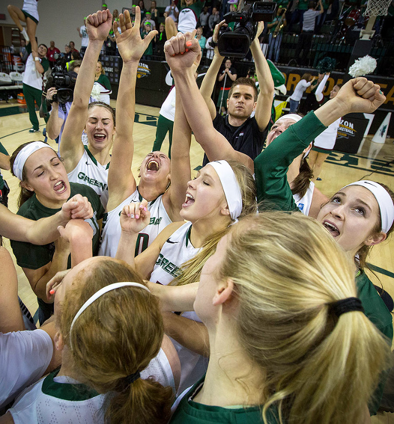 The Green Bay women's basketball team celebrates winning the Horizon League Championship.