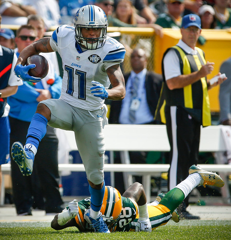 Detroit Lions wide receiver Marvin Jones gets away from Green Bay Packers cornerback Josh Hawkins on a touchdown catch and run.