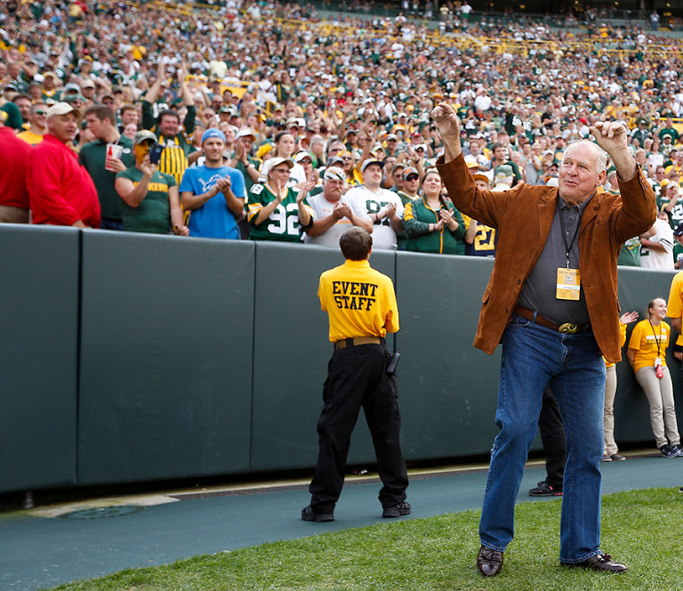 Packers Ice Bowl great Jerry Kramer waves to the fans during alumni introductions.