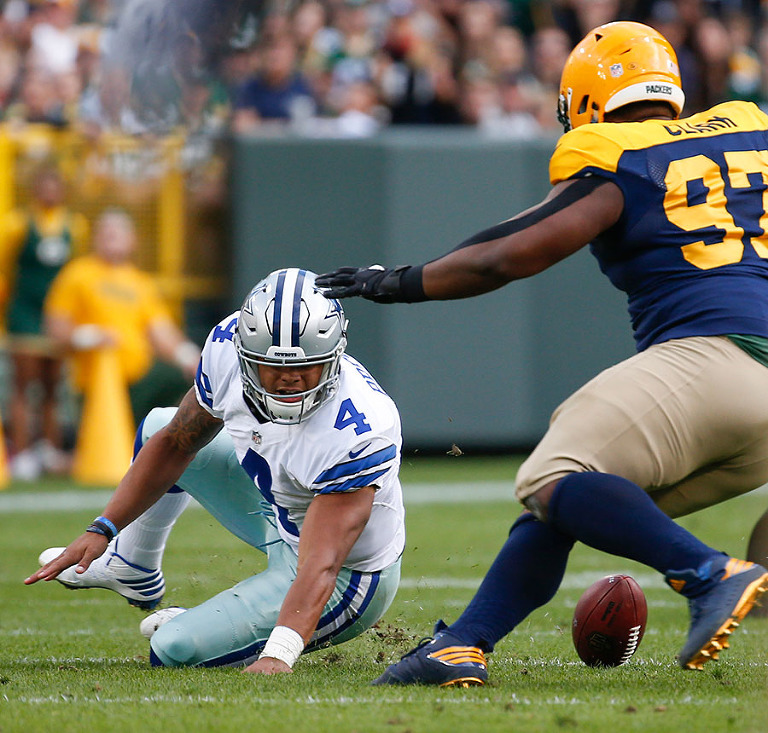 Green Bay Packers nose tackle Kenny Clark chases after a Dallas Cowboys quarterback Dak Prescott fumble.