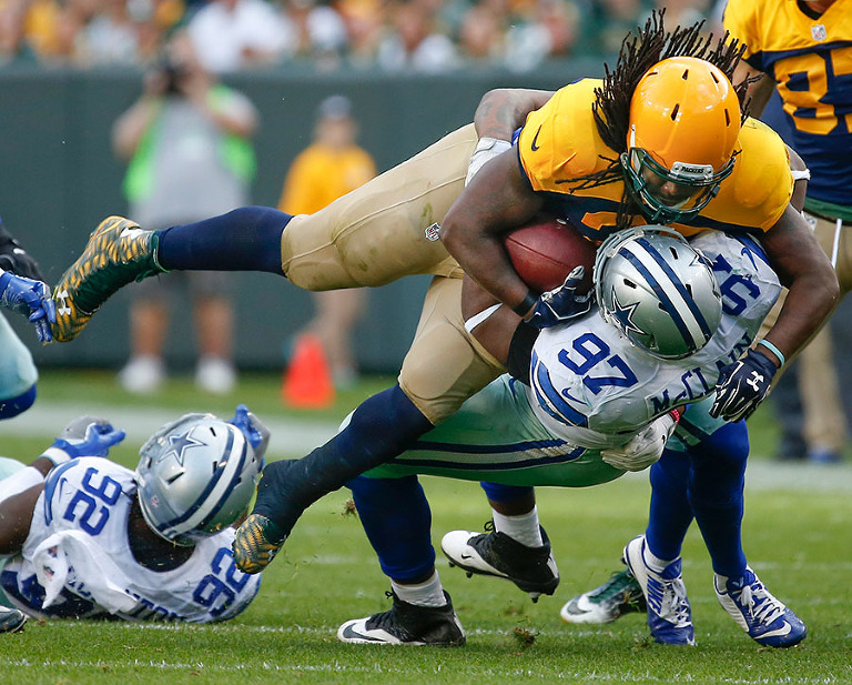 Dallas Cowboys defensive tackle Terrell McClain takes down Green Bay Packers running back Eddie Lacy.