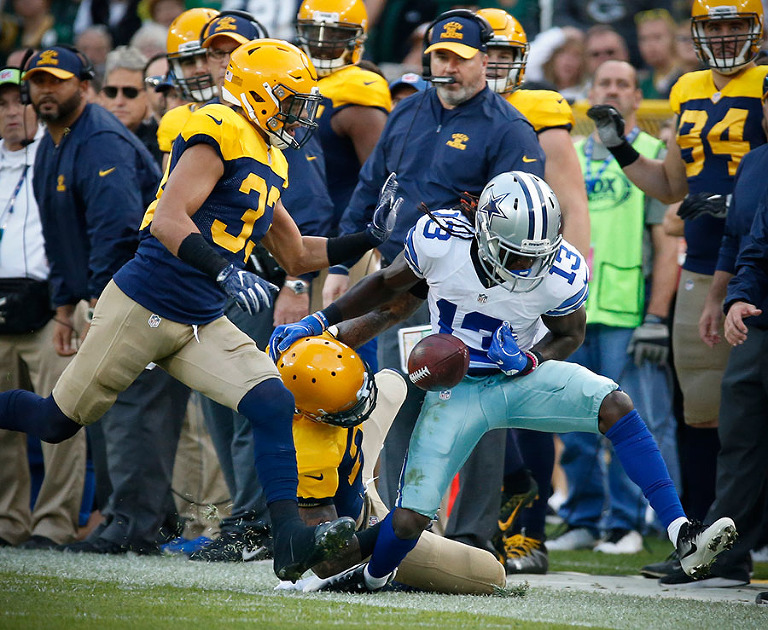 Dallas Cowboys wide receiver Lucky Whitehead looses the ball as he goes out of bounds.