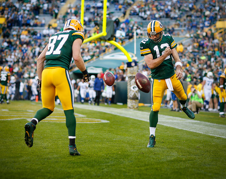 I've shot this photo a number of times, but I think this is my favorite one. Green Bay Packers quarterback Aaron Rodgers and wide receiver Jordy Nelson spin a ball in the end zone after warm ups.