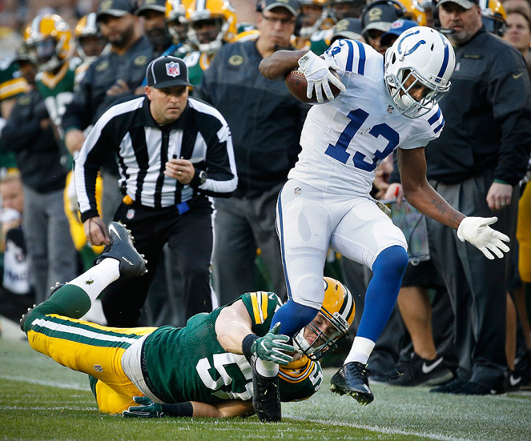 Indianapolis Colts wide receiver T.Y. Hilton gets forced out of bounds by Green Bay Packers outside linebacker Kyler Fackrell.