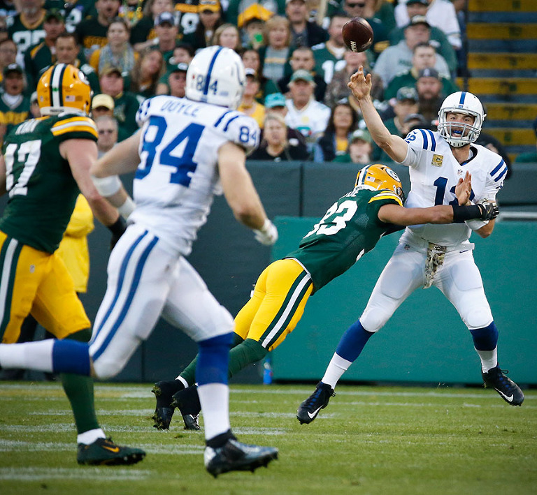 Green Bay Packers strong safety Micah Hyde pressures Indianapolis Colts quarterback Andrew Luck.