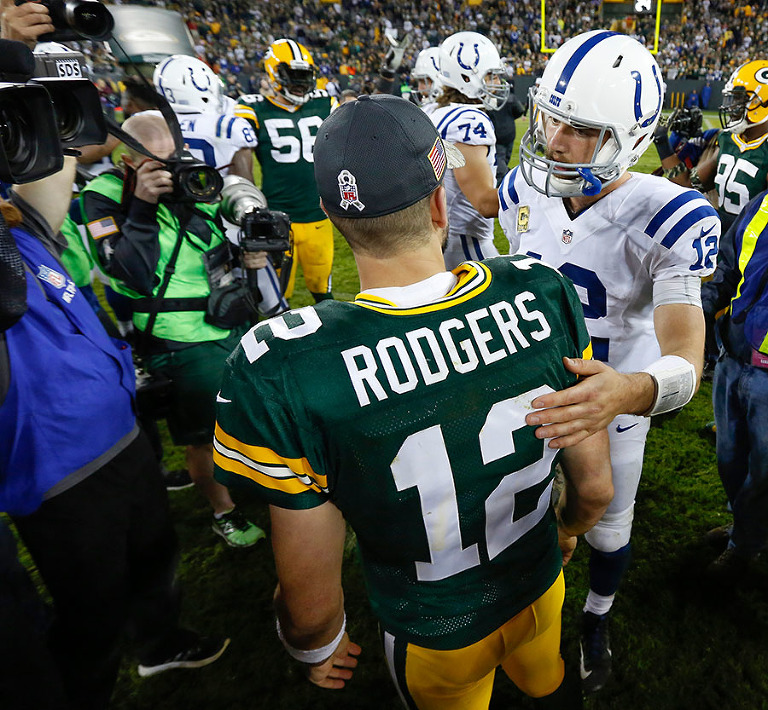 Green Bay Packers quarterback Aaron Rodgers and Indianapolis Colts quarterback Andrew Luck talk after the game.