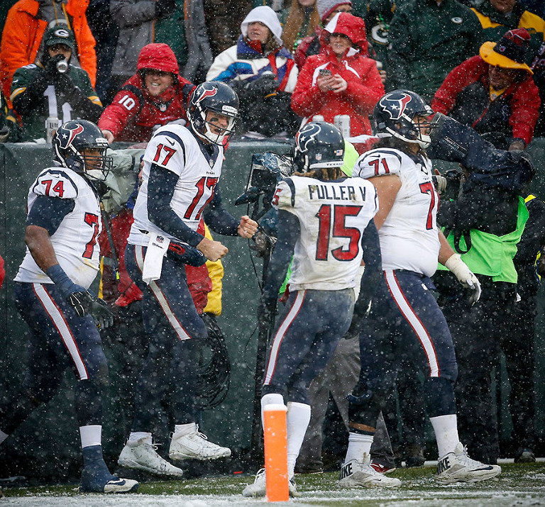Houston Texans quarterback Brock Osweiler celebrates throwing a touchdown.