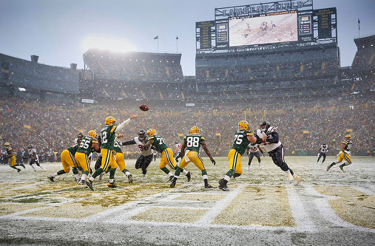 Green Bay Packers quarterback Aaron Rodgers throws out of the end zone.