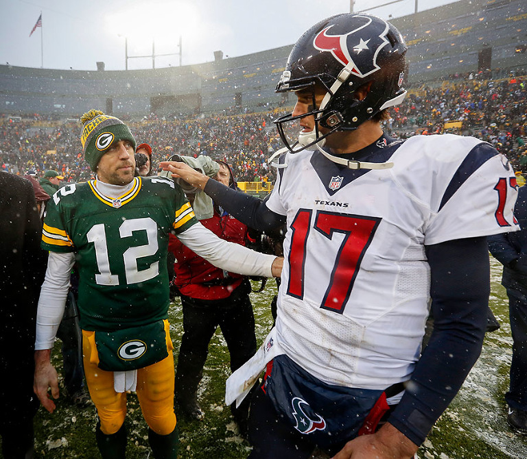 Green Bay Packers quarterback Aaron Rodgers and Houston Texans quarterback Brock Osweiler after the game.