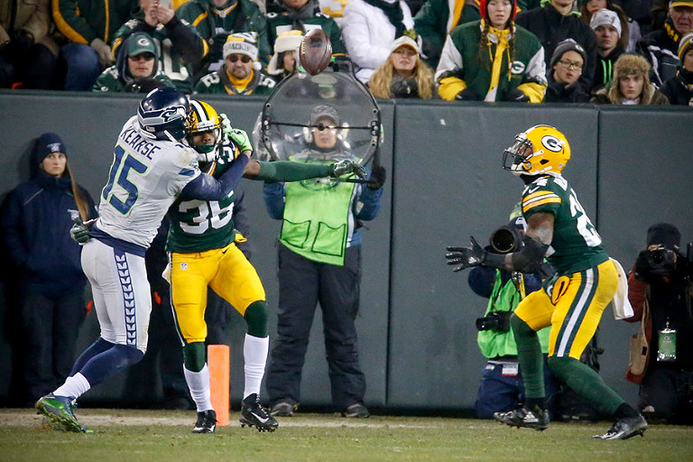Green Bay Packers cornerback Quinten Rollins gets ready to pull in a deflected pass off of Seattle Seahawks wide receiver Jermaine Kearse for an interception.
