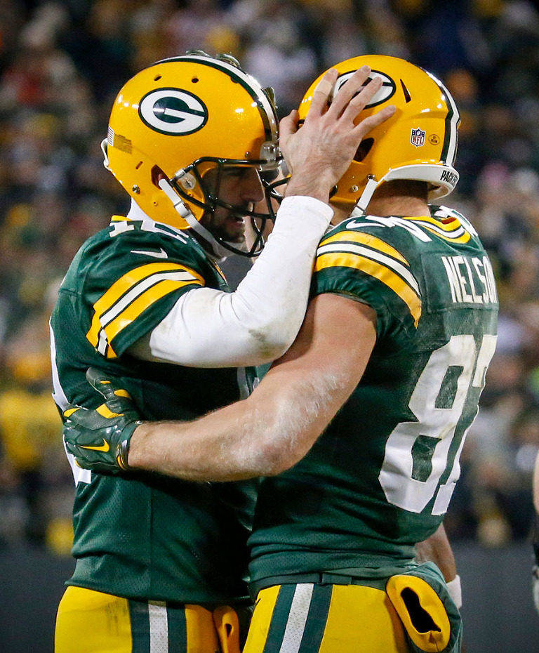 Green Bay Packers quarterback Aaron Rodgers and wide receiver Jordy Nelson celebrate a touchdown.