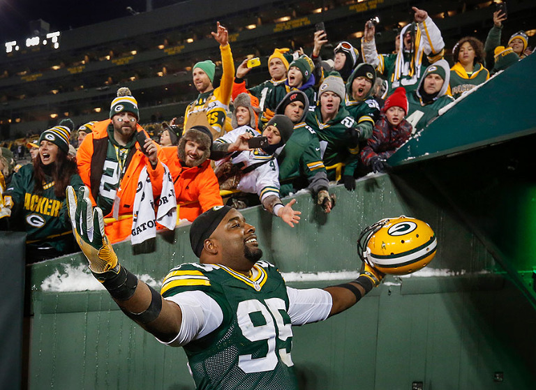 Green Bay Packers defensive end Datone Jones celebrates as he walks off the field after the Packers win.