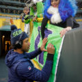 01 Russell Wilson signs autograph Packers