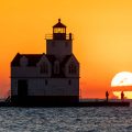Sunrise at the Kewaunee, Wisconsin lighthouse on Lake Michigan.